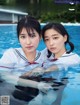 A couple of young women in a swimming pool.