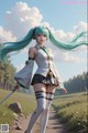 A woman with long green hair holding a sword in a field.